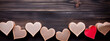 Vintage shabby chic hearts on a wooden background.