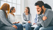 © Prostock-studio - Depressed man sitting at rehab group therapy