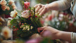Florist crafting elegant bouquet with fresh flowers. Close-up of a florist's hands arranging a colorful bouquet with various blooms and greenery
