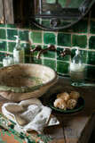 Fototapeta Na sufit - Retro style metal tap and sink in modern bathroom interior with soap bottle and green ceramic tiles wall in the background.