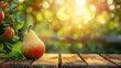 Fresh pear on a wooden table with blurry nature background