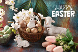 Fototapeta  - Easter card with a wicker basket full of eggs, bunny and lamb figurines and flowers