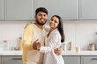 © Prostock-studio - Loving young indian couple dancing in kitchen