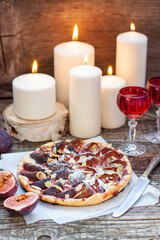 Wall Mural - Fig and Pecan Pie or tart, homemade pie crust with figs, brown sugar, butter, eggs and pecans filling, decorated with fresh figs and toasted pecan
