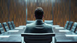Rearview of the businessman wearing an elegant suit, sitting alone on a chair in a boardroom. Boss, CEO or executive getting ready for a meeting with company employees or workers, director, leadership