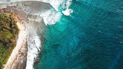 Poster - Aerial top down view of the surfing spot in the Maldives with surfers swimming around