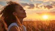 © esp2k - A woman with curly hair is sitting in a field and smiling