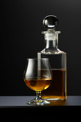 Poster - Old decanter and glass with whiskey, cognac or brandy.