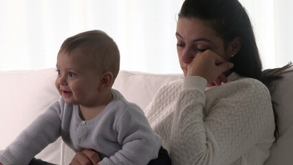 Wall Mural - Fatigued mother rubbing eye feeling exhausted