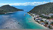 Aerial drone photo of famous seaside village small port and long sandy beach of Tolo with hotels and resorts built by the sea, Argolida, Peloponnese, Greece