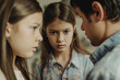 © Enigma - Two young girls and a man are in a close, intense discussion, with one girl's gaze sharply focused.