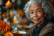 © Good AI - An elderly woman with graceful gray hair and a warm smile sits elegantly at a festive table.