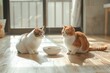 Two cats eyeing food bowl indoors.