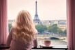 Girl smiling happily and drinking a cup of coffee on the balcony, Paris tower in the window, trip to Paris