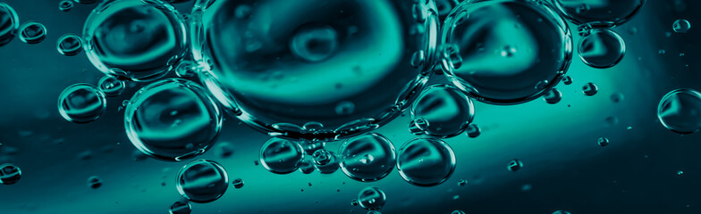 oil drops on water on blue background