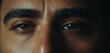 Close-up face of an adult man, dark hair, eyes, evil eye, reveng
