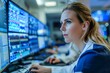 © Anastasiia - A woman is monitoring data on computer screens in a hospital room. Concept Medical Technology, Healthcare Monitoring, Data Analysis, Hospital Setting, Professional Woman