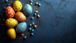  A collection of colorful eggs arranged atop a blue-toned base with orange and blue dots scattered about