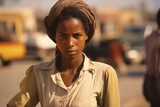 Fototapeta Nowy Jork - Young woman serious face on city street in 1970s