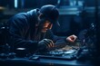Technician repairing a computer at night. Repair and maintenance concept.
