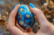 Easter egg in hand, macro