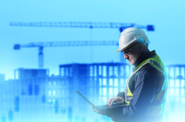 Poster - man inspector from construction industry. builder with laptop in hands. inspector near house under c