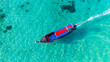 © Alisa - Traditional Thai longtail boat in the shallow waters of Phi Phi island, Krabi, Thailand. Boat tour in South East Asia concept.