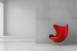 A minimalist image of a sleek, modern office space with a single, striking red chair in the center.