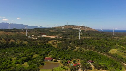 Wall Mural - Aerial drone of Wind turbines producing clean sustainable energy, clean energy future. Wind power plant. Philippines.