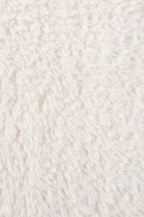 white plush fabric texture background, background pattern of soft warm material