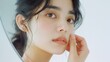 © Pro Hi-Res - Young Asian woman touching healthy facial beauty skin look at mirror. makeup of beauty facial girl with skincare and cosmetic treatment, skin care and healthy concept.