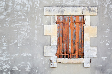 Sticker - closed window shutters with peeling red paint