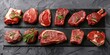 Top view of various raw meat, Beef steaks on gray stone.