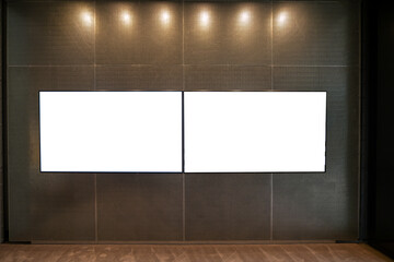 Wall Mural - Sophisticated dual horizontal blank billboards in a modern interior: A mockup template featuring two empty white digital screens mounted on a wall, for showcasing information or media in an urban room