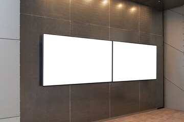 Wall Mural - Two Modern Blank Billboards for Advertising in Commercial Space. Empty white mockup background of 2 digital screens mounted on the wall in an urban room.