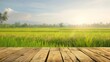 Wooden table top on blur rice field background in morning beautiful  rice plantation with natural sky view For montage product display copy space : Generative AI