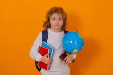 Aufkleber - School boy with world globe and book. Kid boy from elementary school. Little student, smart nerd pupil ready to study. Concept of knowledge, education and learning