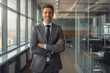 © PicMedia - Caucasian business man portrait. Handsome, happy man wearing suit standing in modern office. Smiling white male manager looking at camera in workplace area.