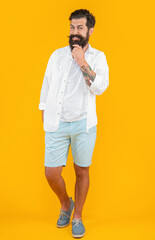 Wall Mural - photo of bearded guy wearing summer fashion. bearded guy isolated on yellow. bearded guy