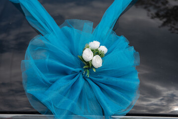 Wall Mural - car decorated with a blue lace flower at a wedding