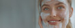 © Daria Lukoiko - A beautiful woman in the process of cleansing her face with gel foam and moisturizing with a mask. The girl's skin looks soft and smooth and has a healthy glow. Space for copy and space for text