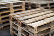 Stack of wooden pallet. Industrial wood pallet at factory warehouse.