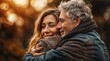 © engkiang - Portrait of a happy senior couple embracing each other in autumn park