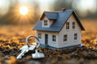 Key to Home of a small cottage with keys against a blue sky background, symbolizing the concept of real estate and homeownership