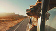 sunset, vacation concept dog wearing sunglasses, sticking its head out of a car window, enjoying the breeze and the adventure of the open road