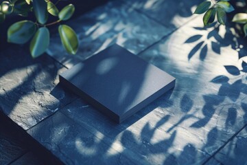 Poster - A black square box sitting on a stone floor. Suitable for various design projects