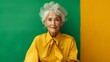 Graceful Senior Lady in Yellow with Green Backdrop