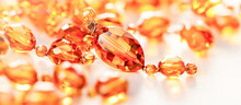 A Close Up Of A Bunch Of Orange Beads, Amber