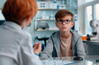Concentrated boy in glasses at the doctors'. Concept of healthcare and pediatric medical services