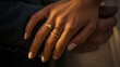 © MP Studio - Two hands with wedding and engagement rings gently touch, symbolizing union.